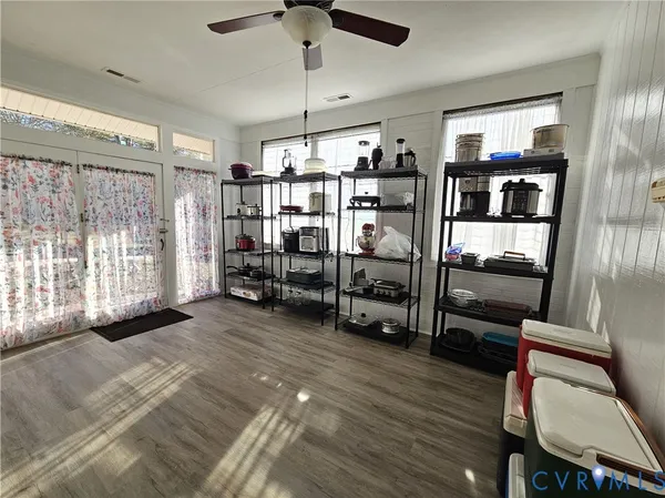 a view of front door with workspace and windows