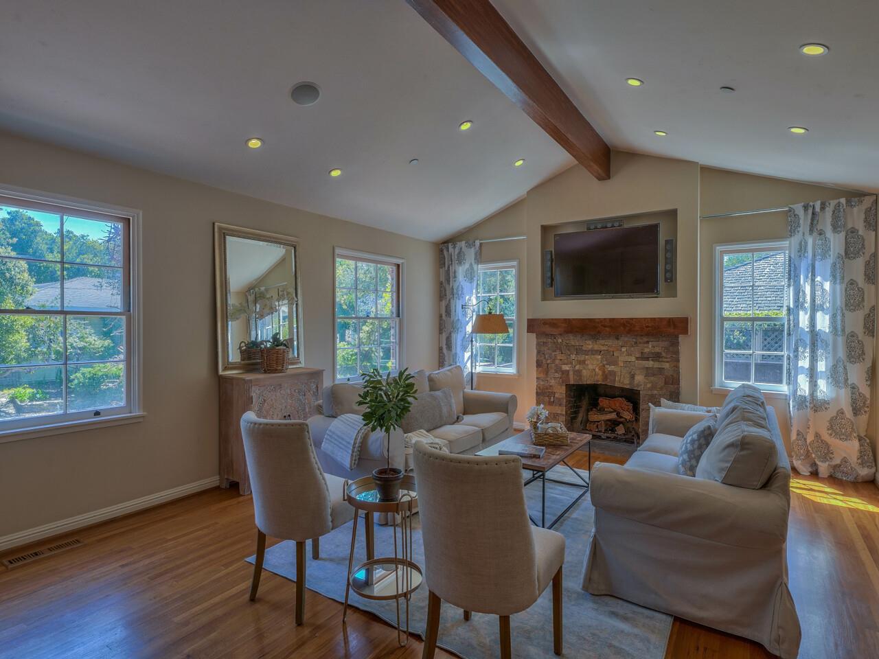 2 Perry Newberry Way Carmel, CA 93923 - Photo 13 of 30 a living room with furniture a fireplace and a flat screen tv