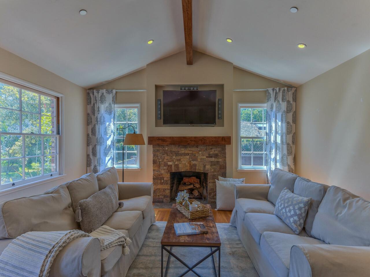 2 Perry Newberry Way Carmel, CA 93923 - Photo 14 of 30 a living room with furniture a flat screen tv and a fireplace