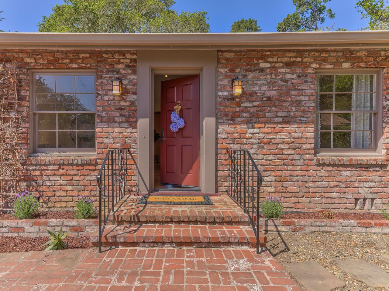 2 Perry Newberry Way Carmel, CA 93923 - Photo 2 of 30 a front view of a house with a garden