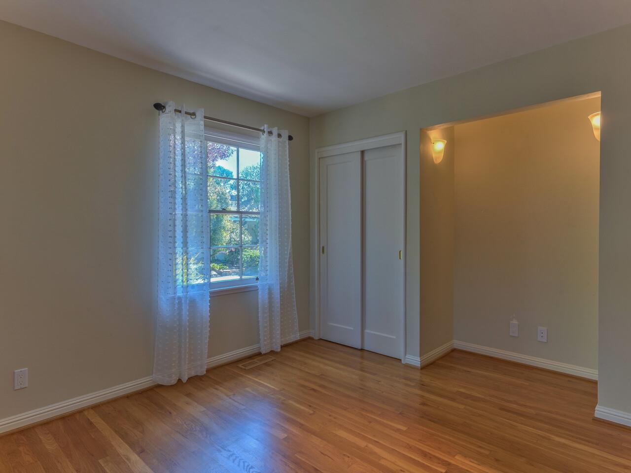 2 Perry Newberry Way Carmel, CA 93923 - Photo 23 of 30 a view of an empty room with wooden floor and a window