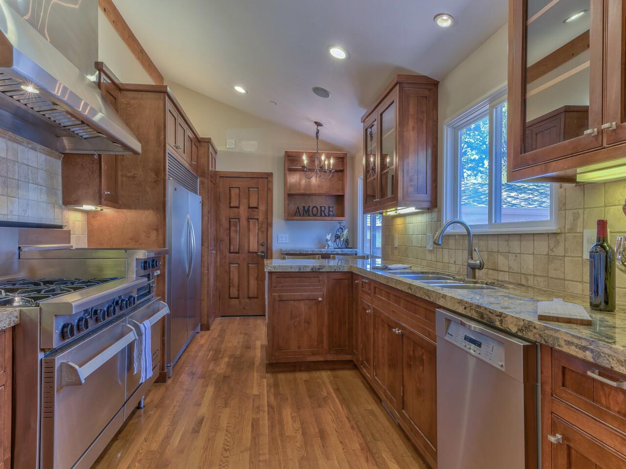 2 Perry Newberry Way Carmel, CA 93923 - Photo 3 of 30 a kitchen with stainless steel appliances granite countertop a stove a sink dishwasher and a refrigerator