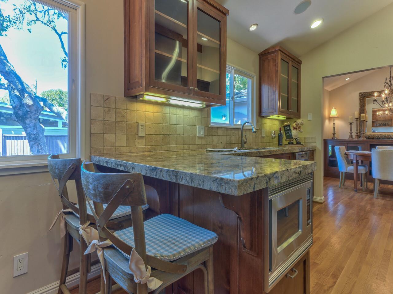2 Perry Newberry Way Carmel, CA 93923 - Photo 6 of 30 a kitchen with a table and chairs in it