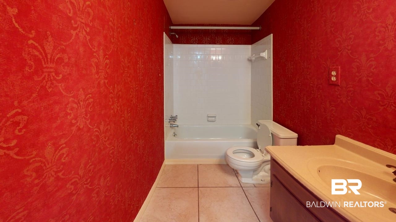 4009 Old Shell Road, Unit C13 Mobile, AL 36608 - Photo 19 of 32 Full bath featuring toilet, shower / bathtub combination, tile patterned floors, and vanity