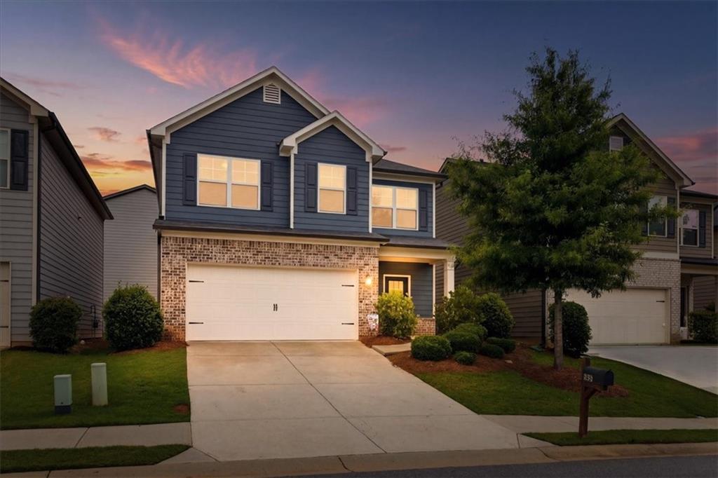 585 Summit Point Canton, GA 30114 - Photo 2 of 30 a front view of a house with a yard