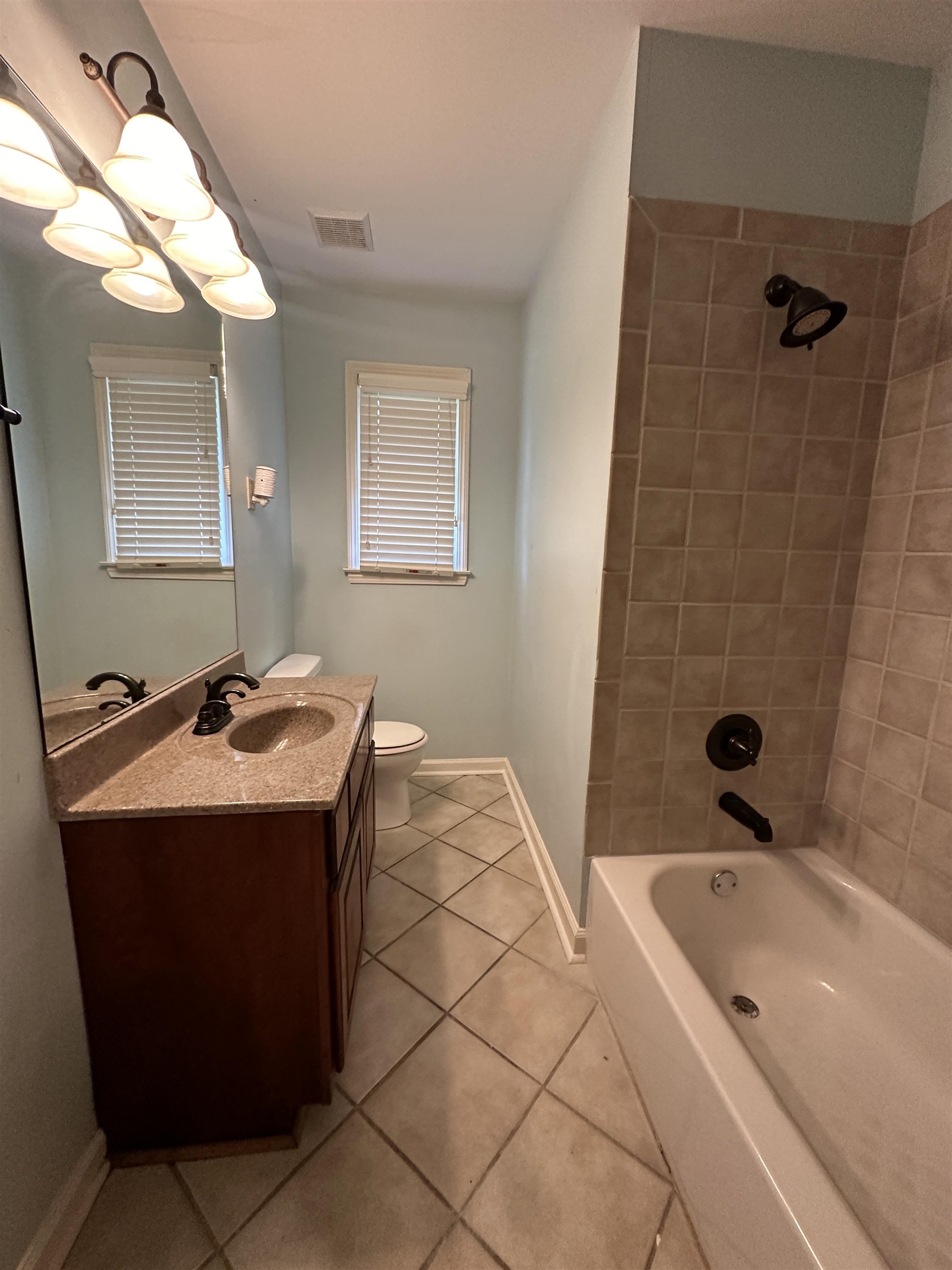 3201 Ladbrook Road Memphis, TN 38118 - Photo 11 of 20 a bathroom with a sink and a mirror