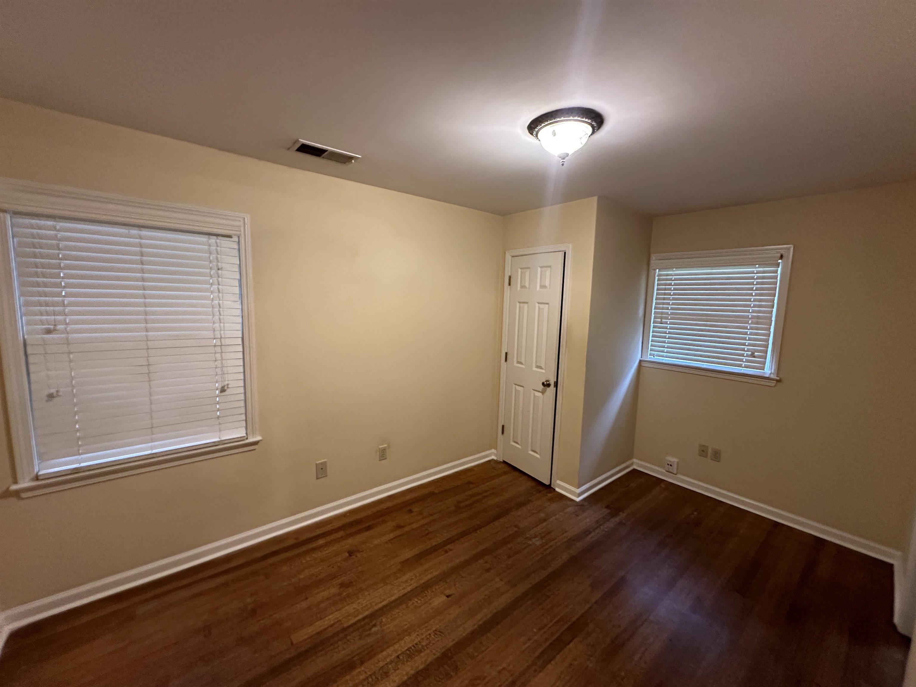3201 Ladbrook Road Memphis, TN 38118 - Photo 9 of 20 a view of a room with wooden floor and windows