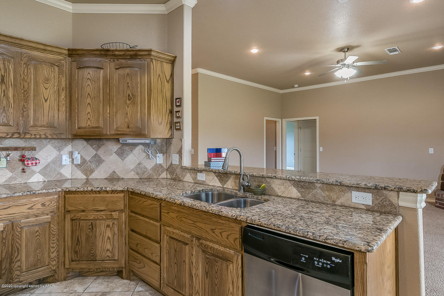 17701 Morning Star Road Amarillo, TX 79124 - Photo 4 of 10 a kitchen with a sink dishwasher and cabinets