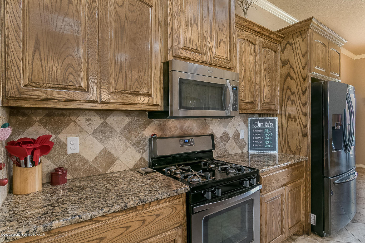 17701 Morning Star Road Amarillo, TX 79124 - Photo 5 of 10 a kitchen with granite countertop cabinets and steel stainless steel appliances