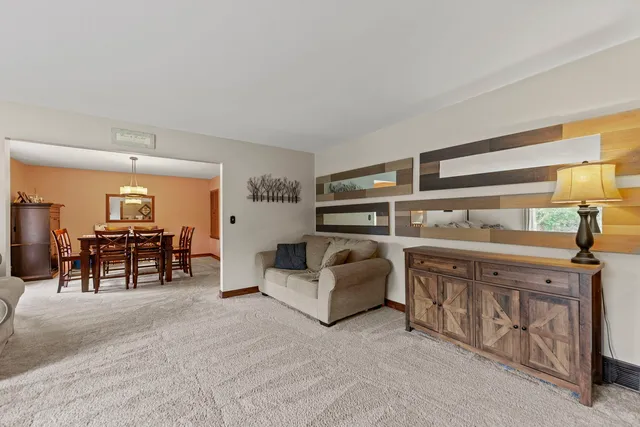 a living room with furniture and a table