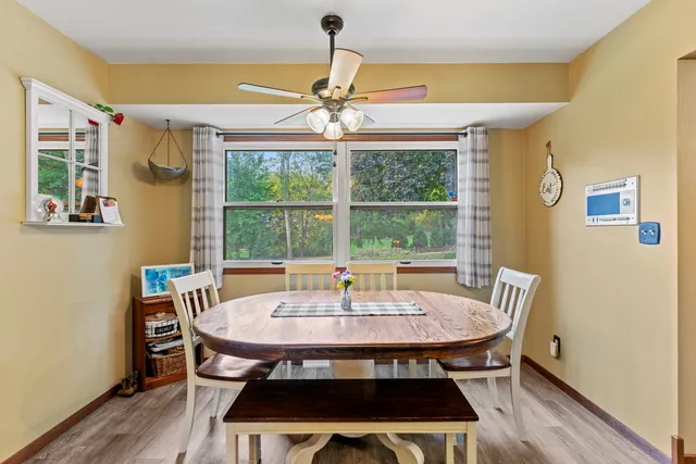 a dining room with furniture and window