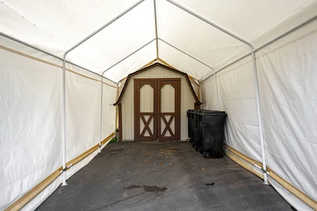 a view of a dining table and chairs in the yard