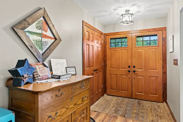 a bathroom with a sink a mirror and a window