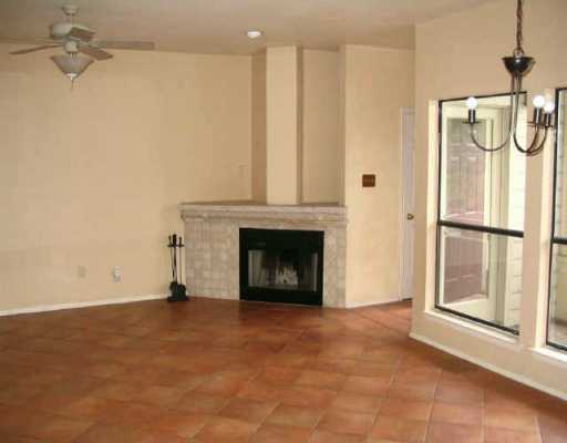 6600 Valleyside Road, Unit 13 Austin, TX 78731 - Photo 1 of 1 a view of an empty room with a fireplace