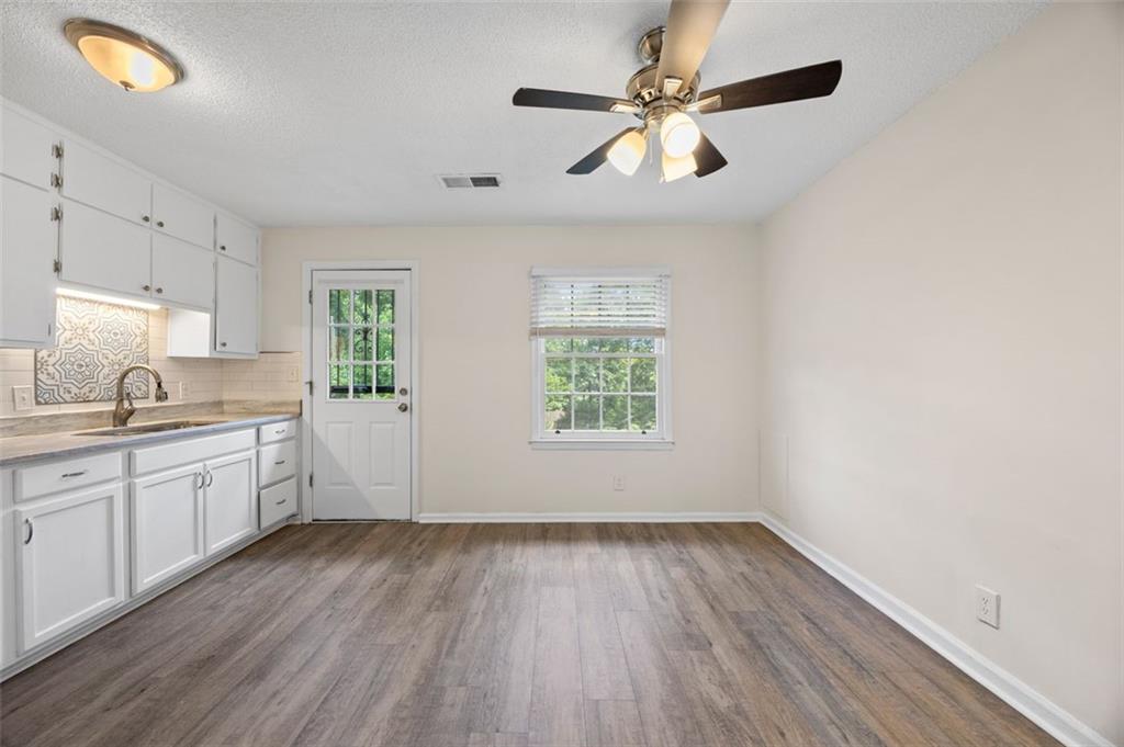135 East Hill Street, Unit 22 Decatur, GA 30030 - Photo 11 of 18 a view of a kitchen with a sink dishwasher and a microwave