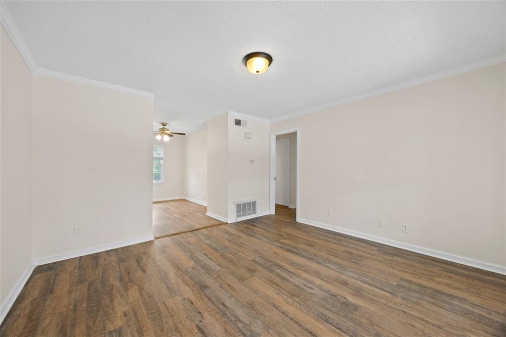 135 East Hill Street, Unit 22 Decatur, GA 30030 - Photo 8 of 18 a view of an empty room and wooden floor