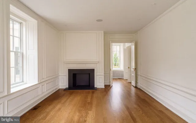 a room with a chair and a window