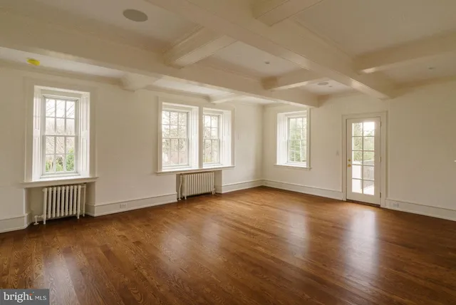 a bathroom with a granite countertop sink a mirror and a shower