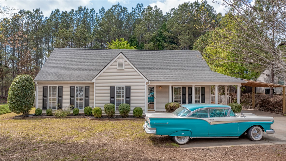 102 Hawk Ridge Drive Anderson, SC 29621 - Photo 1 of 38 This charming home features a classic design with an inviting front porch and a lush, tree-lined backdrop.