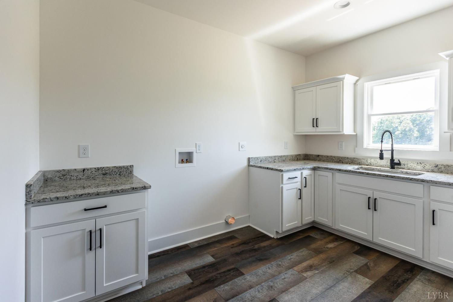 9740 Oakville Road Gladstone, VA 24553 - Photo 43 of 75 a kitchen with granite countertop cabinets stainless steel appliances a sink and a window