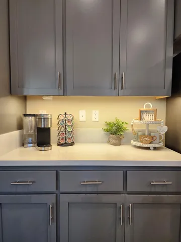 a kitchen with a sink and cabinets