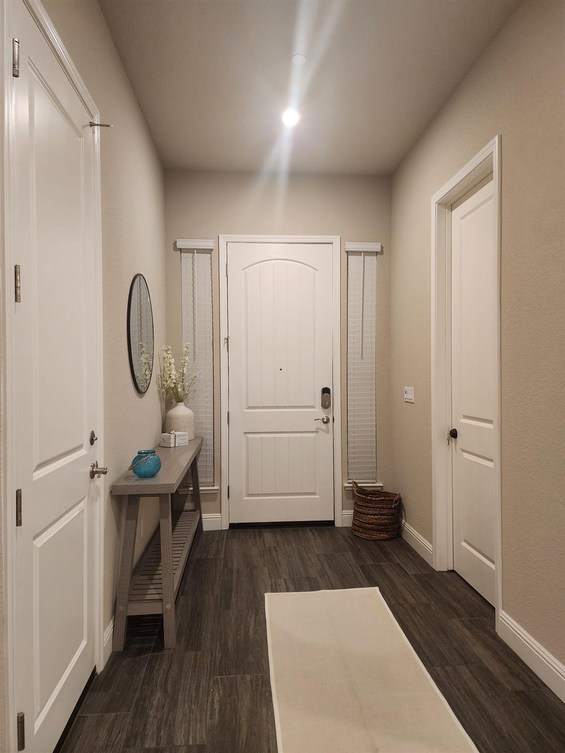 1820 Van Ruiten Drive Lodi, CA 95242 - Photo 14 of 32 Door on the right leads to a private suite that inclues a kitchenette, living room, bedroom, full bath, with its own access to the 1 car garage. Door on the left leads to the 2 car garage.