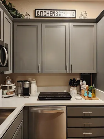 a kitchen with a sink and cabinets