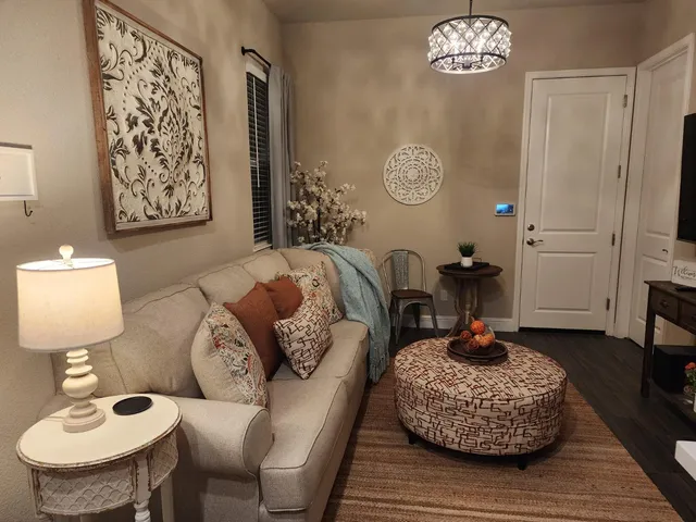 a living room with furniture and a table