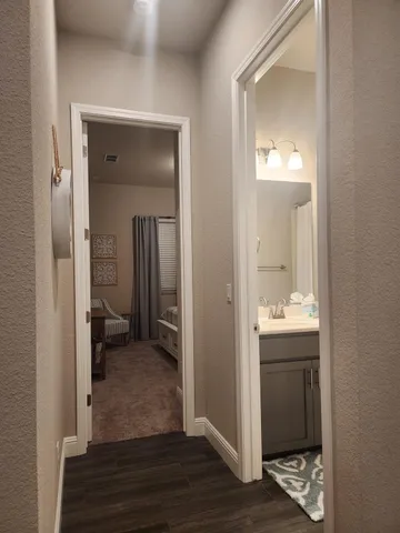 a view of a bathroom from a hallway