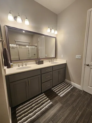 a bathroom with a sink and a mirror