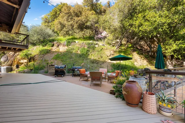 a room with furniture a large window and storage