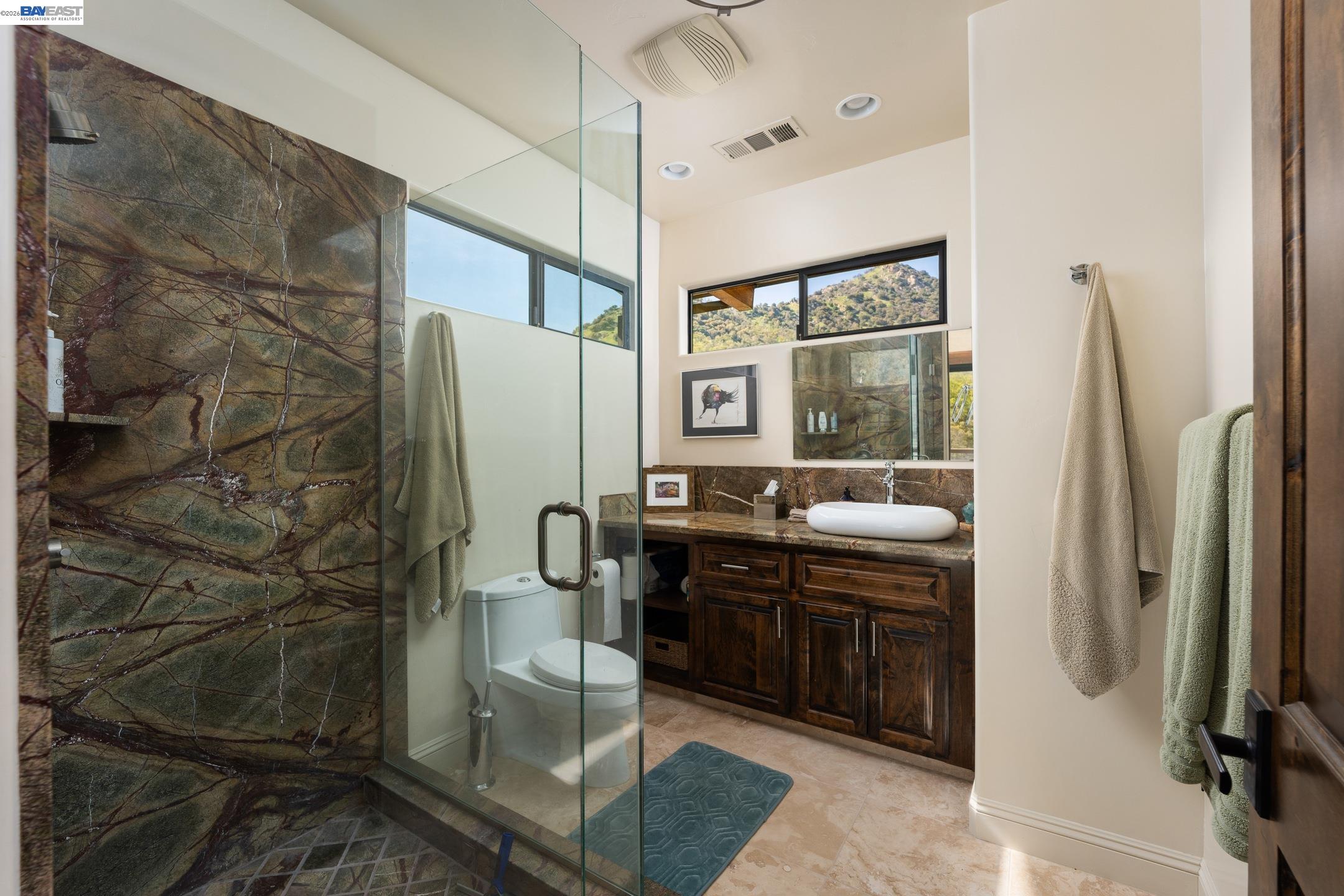 48250 South Fork Drive Three Rivers, CA 93271 - Photo 7 of 48 a bathroom with a glass shower door and a sink