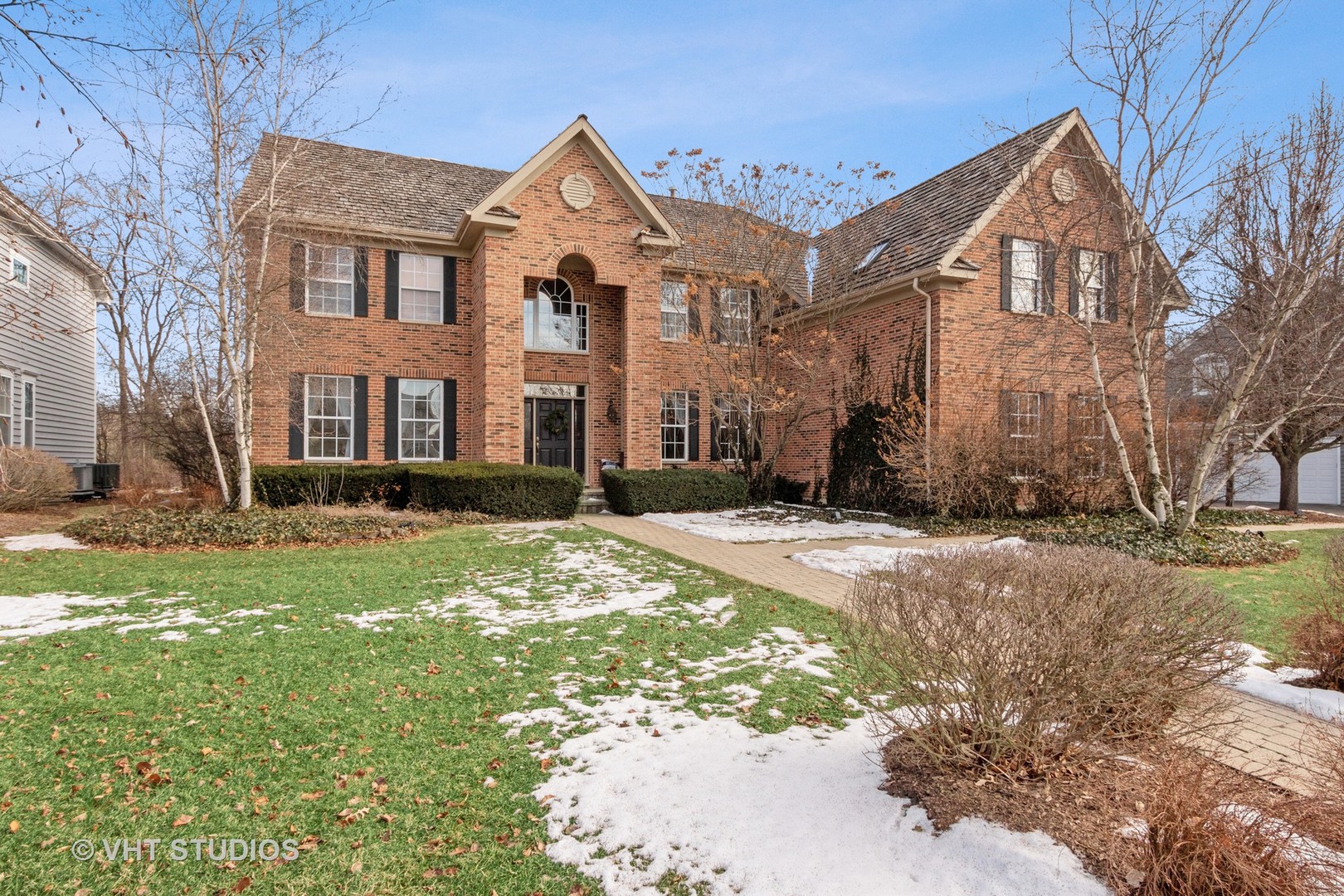 a front view of a house with a yard