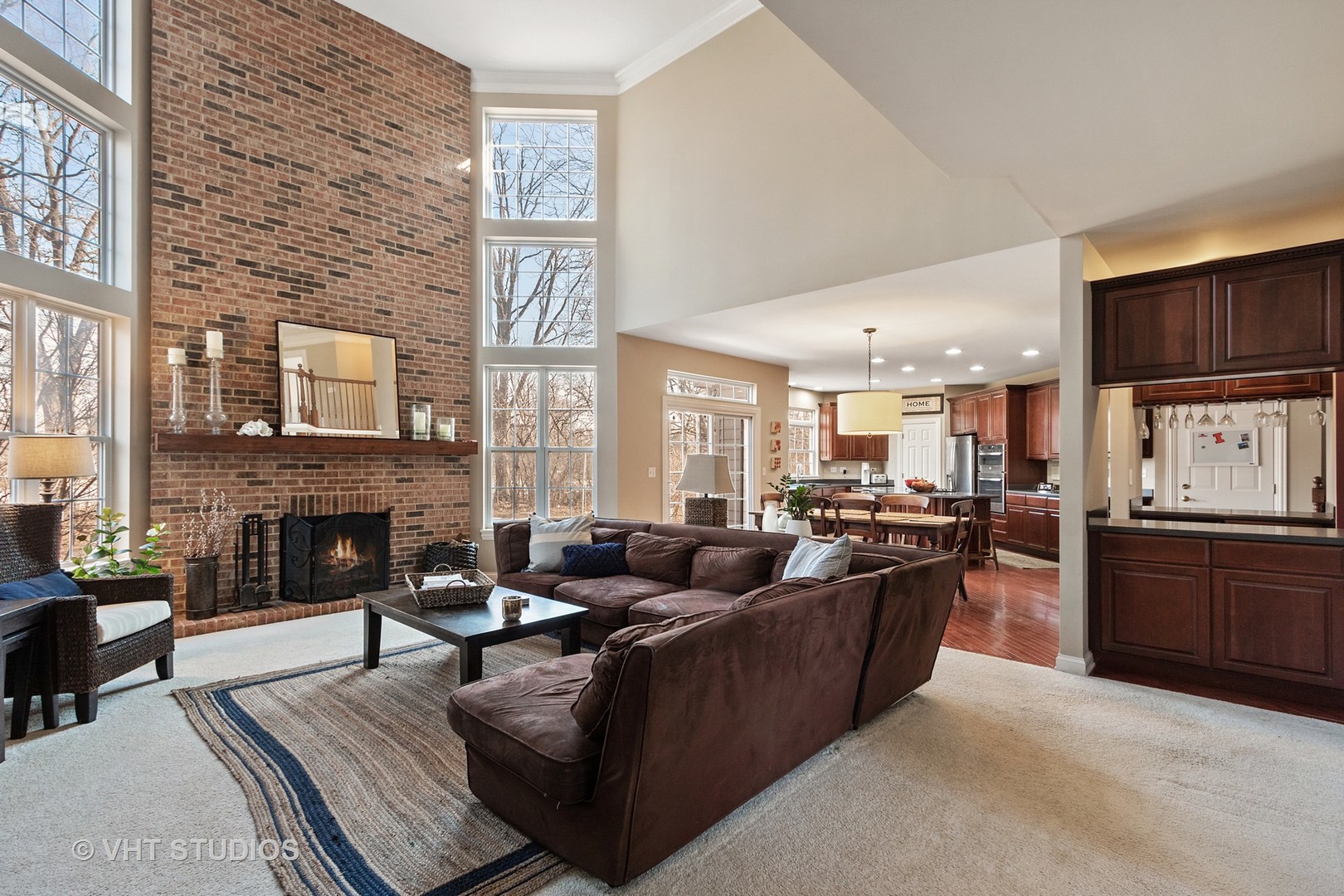 411 Morgan Lane Fox River Grove, IL 60021 - Photo 11 of 37 a living room with fireplace furniture and a kitchen view