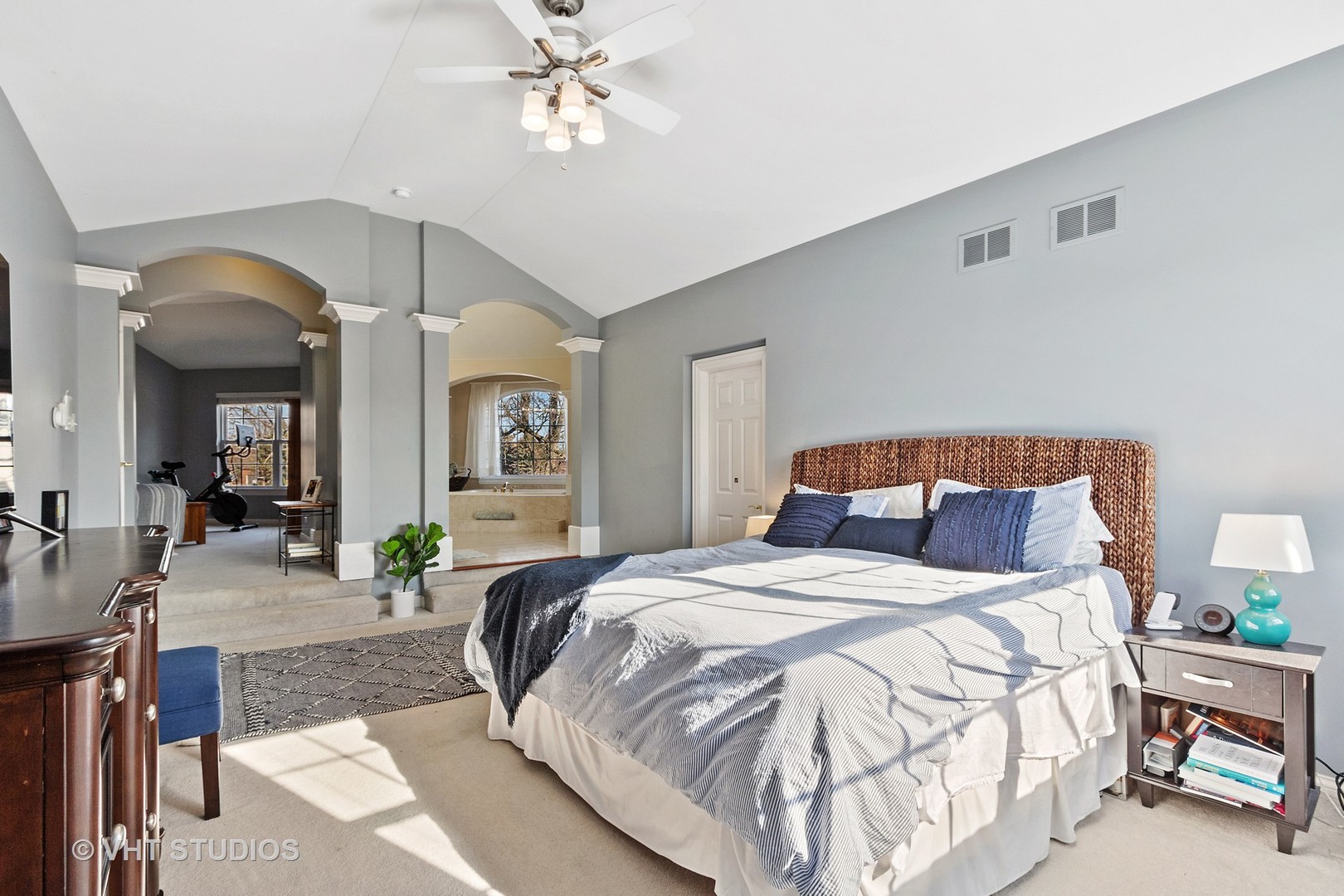 411 Morgan Lane Fox River Grove, IL 60021 - Photo 17 of 37 a bedroom with a large bed and a chandelier