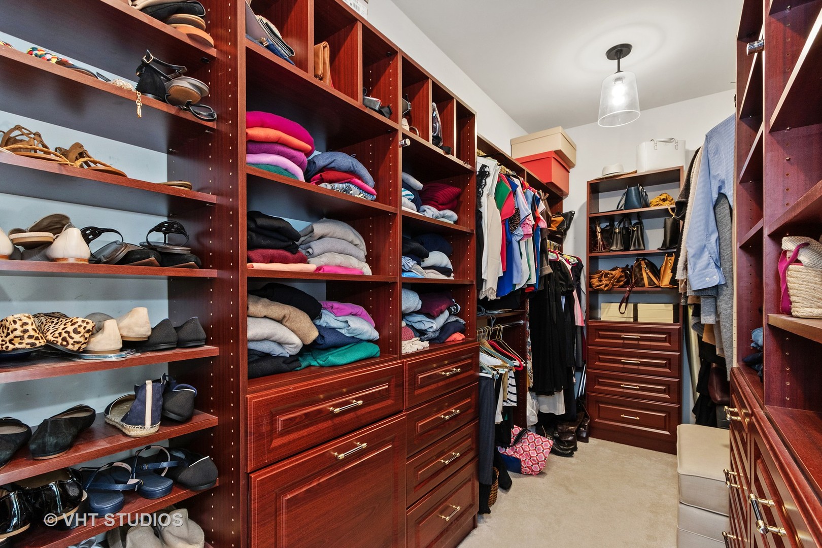 411 Morgan Lane Fox River Grove, IL 60021 - Photo 19 of 37 a view of walk in closet with clothes and shoes