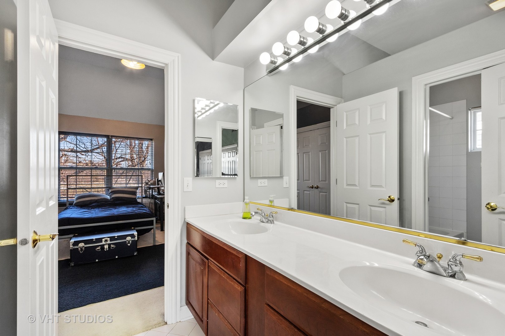 411 Morgan Lane Fox River Grove, IL 60021 - Photo 29 of 37 a en suite bathroom with a double vanity sink and a mirror