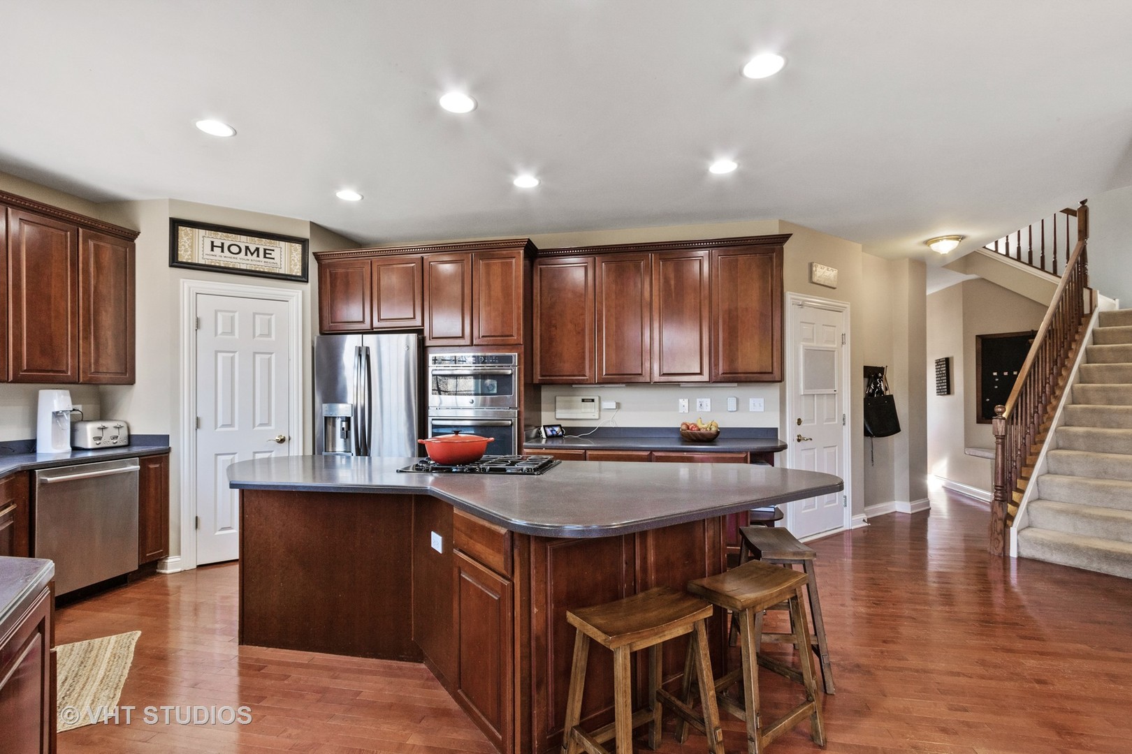 411 Morgan Lane Fox River Grove, IL 60021 - Photo 6 of 37 a kitchen with stainless steel appliances granite countertop counter space a sink and a refrigerator