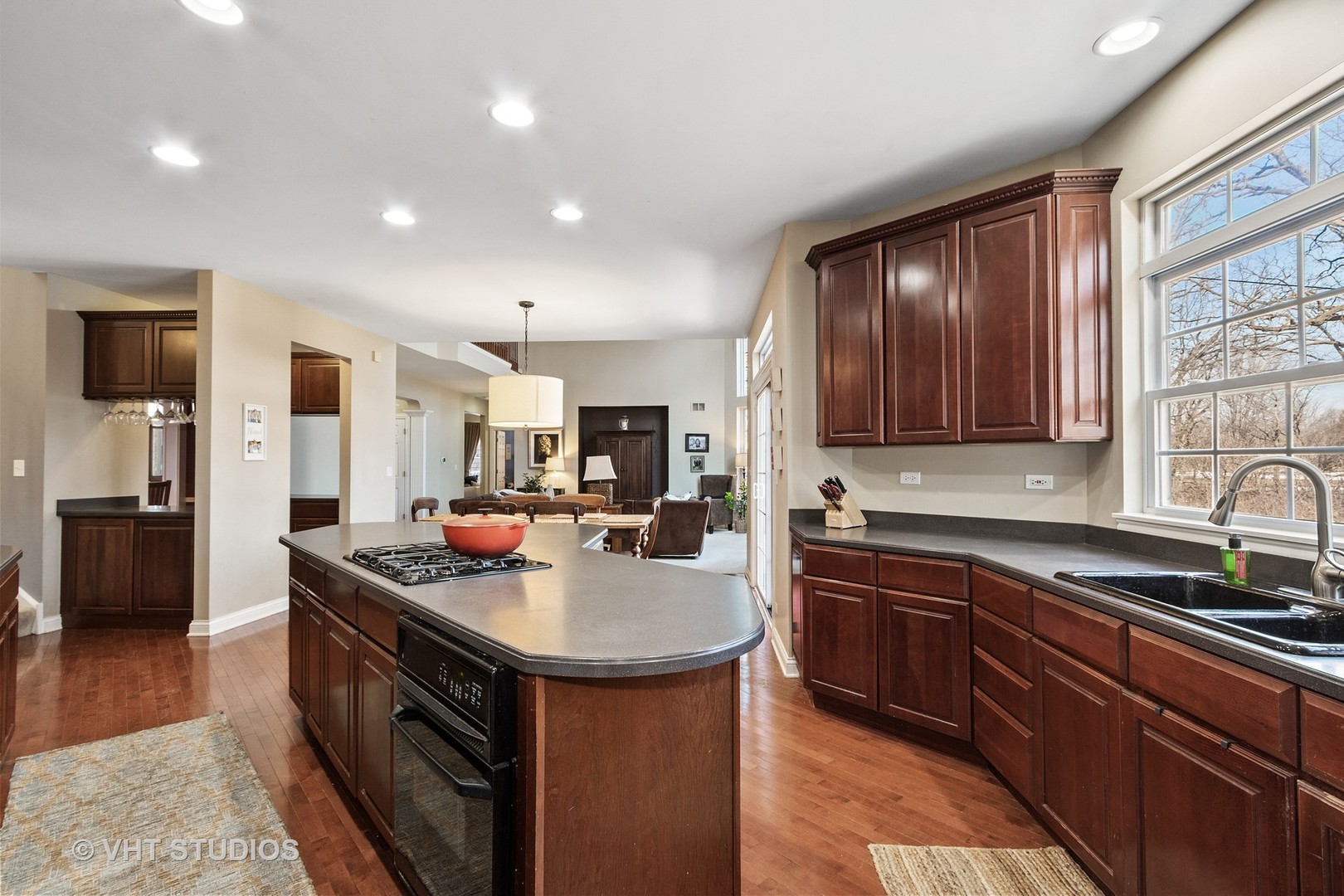 411 Morgan Lane Fox River Grove, IL 60021 - Photo 8 of 37 a kitchen with a sink stove and cabinets