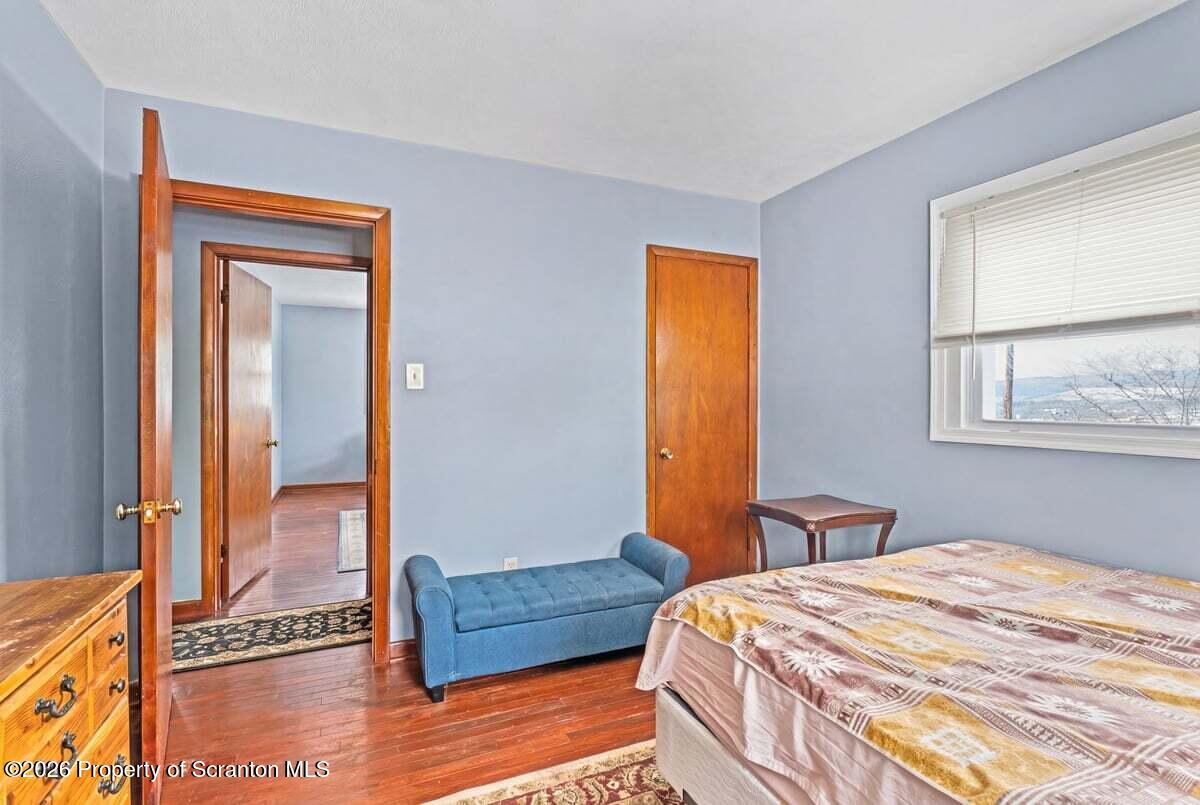 833 Palm Street Scranton, PA 18505 - Photo 14 of 33 a bedroom with a bed and a window