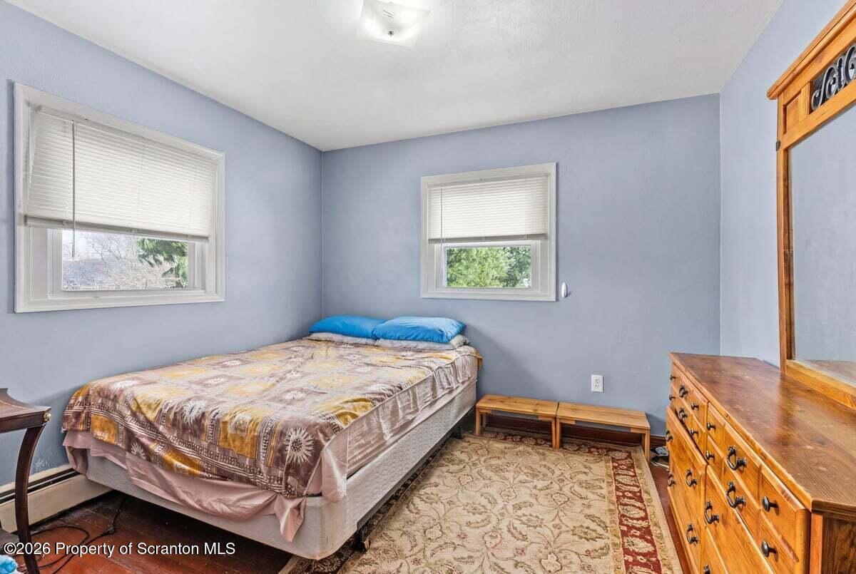 833 Palm Street Scranton, PA 18505 - Photo 15 of 33 a bedroom with a bed and a window