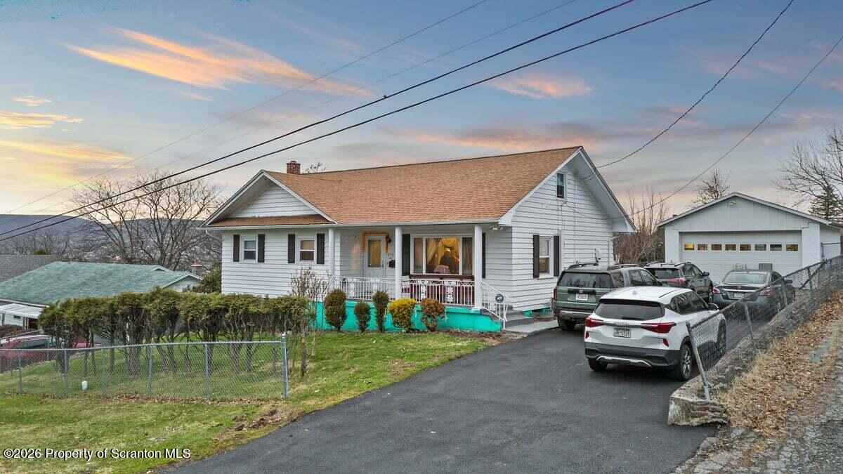 833 Palm Street Scranton, PA 18505 - Photo 3 of 33 a front view of a house with a garden and plants