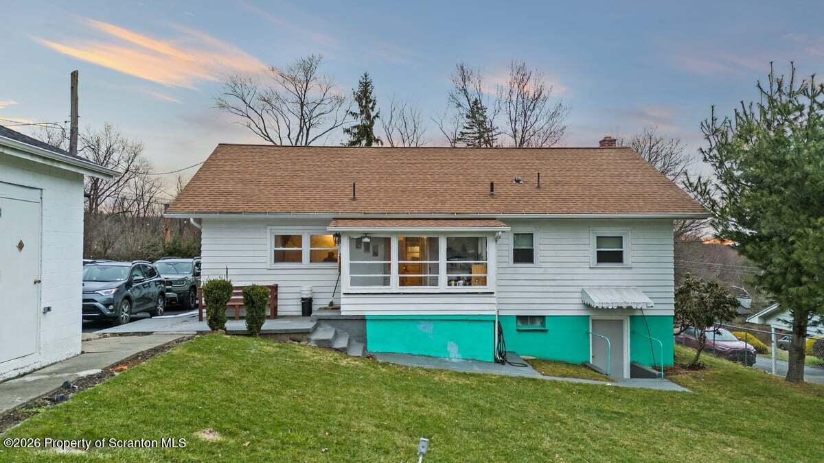833 Palm Street Scranton, PA 18505 - Photo 5 of 33 a view of a house with a yard porch and sitting area