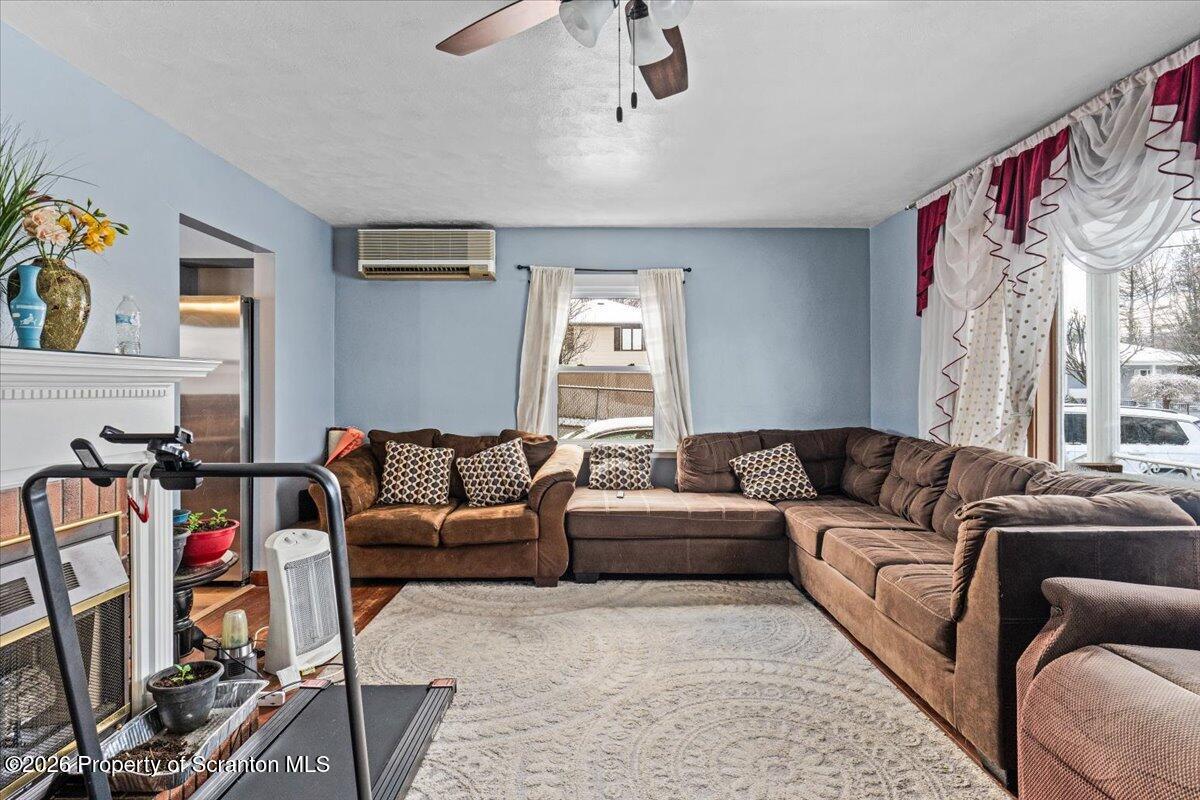 833 Palm Street Scranton, PA 18505 - Photo 6 of 33 a living room with furniture a couch and a window