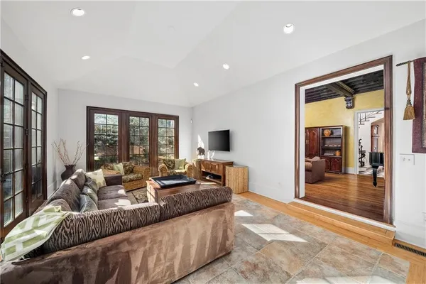 a living room with furniture and a fireplace