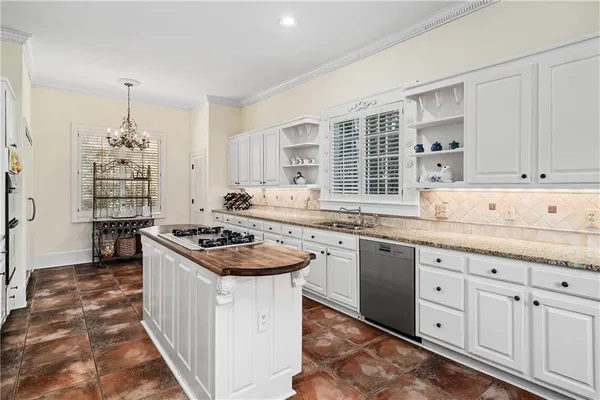 a spacious bathroom with a granite countertop sink a mirror and shower