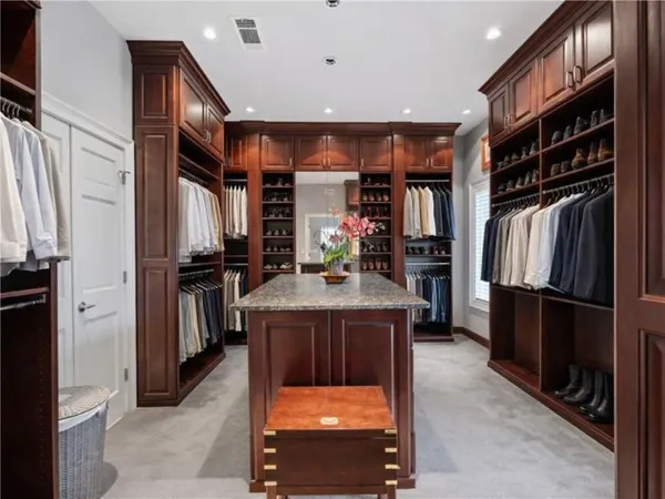 a spacious bathroom with a tub shower and sink