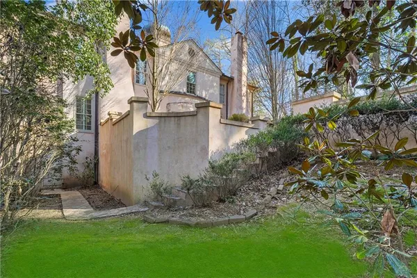 a backyard of a house with lots of green space