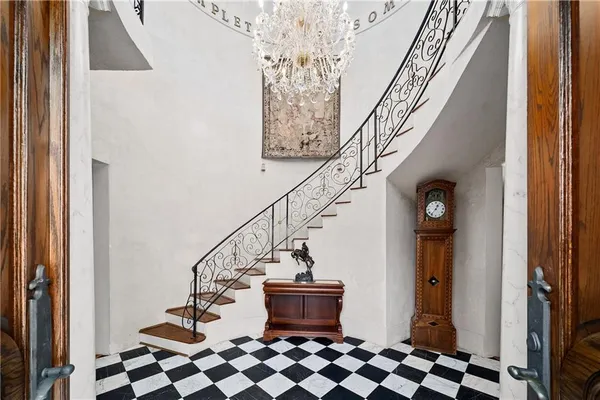 a view of entryway with wooden floor and stair