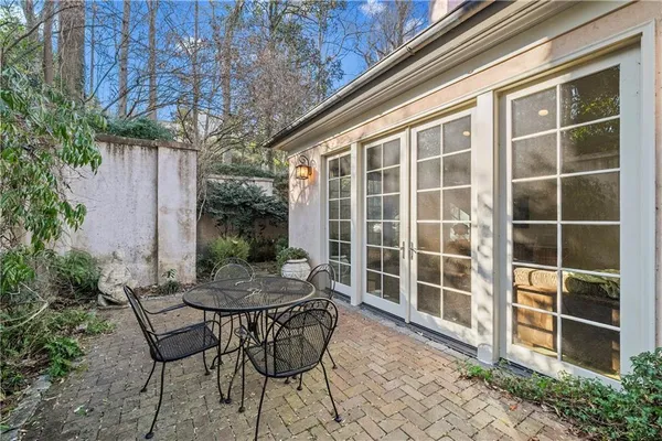 a view of a tables and chairs in the backyard